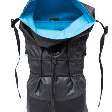 The black Mika Braasi backpack showing its blue inner lining and practical inside pockets